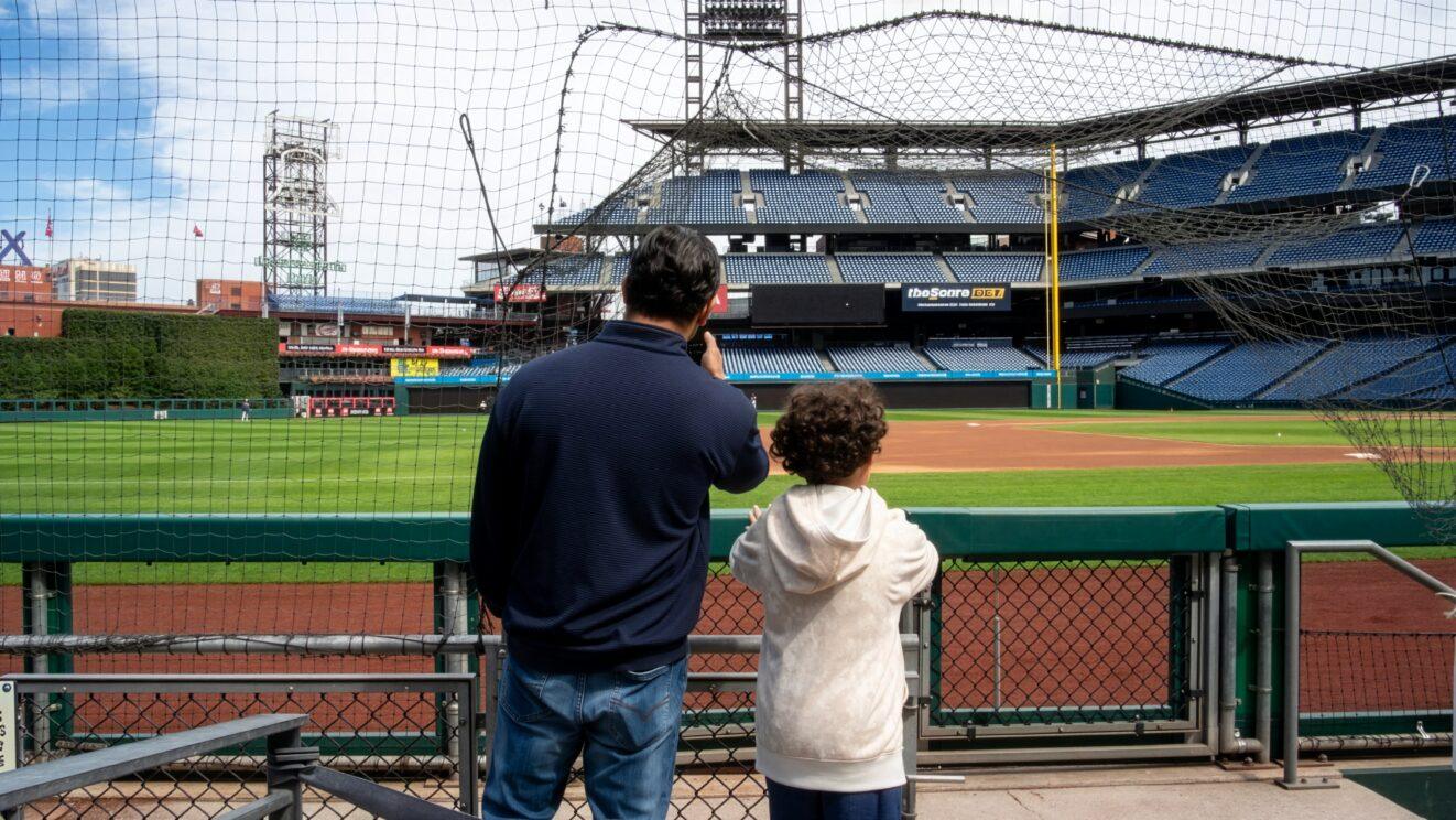 A father and son look out at the field at Citizens Bank Park.